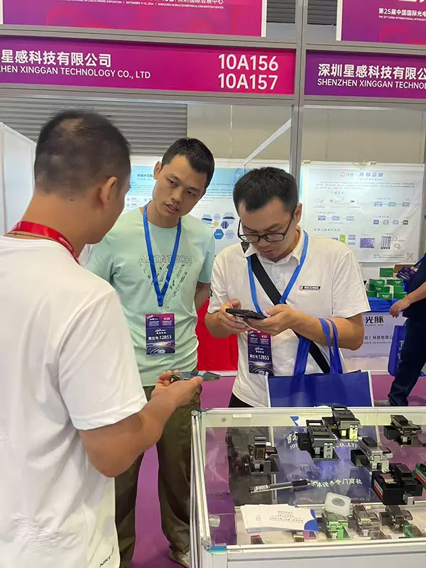 Interacting with and taking photos with clients at CIOE 2025
