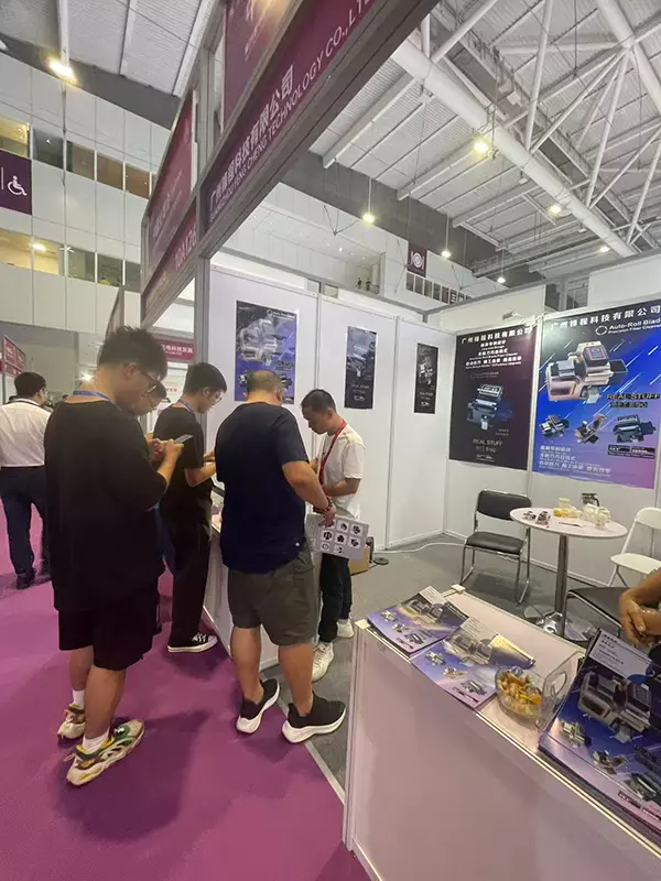 Interacting with and taking photos with clients at CIOE 2025