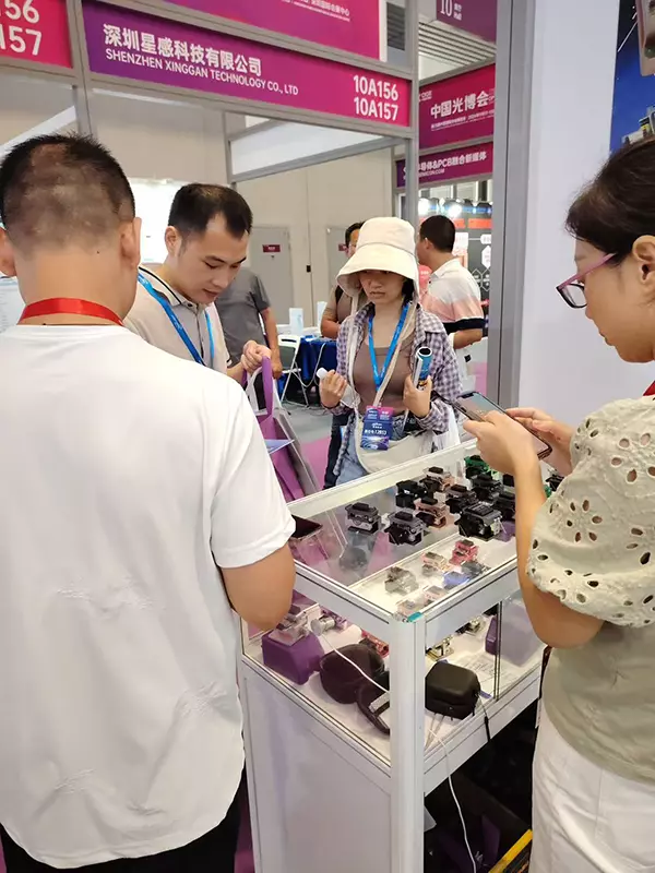 Interacting with and taking photos with clients at CIOE 2025