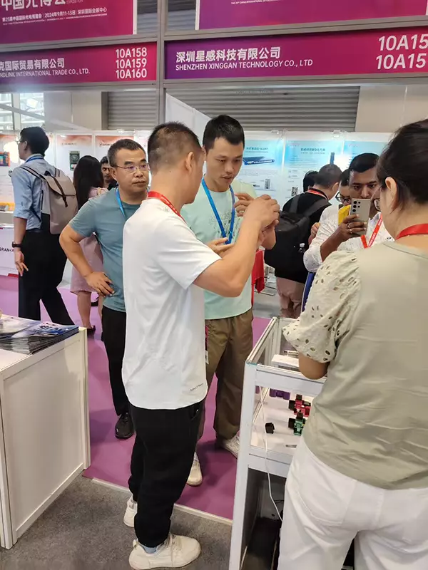 Interacting with and taking photos with clients at CIOE 2025